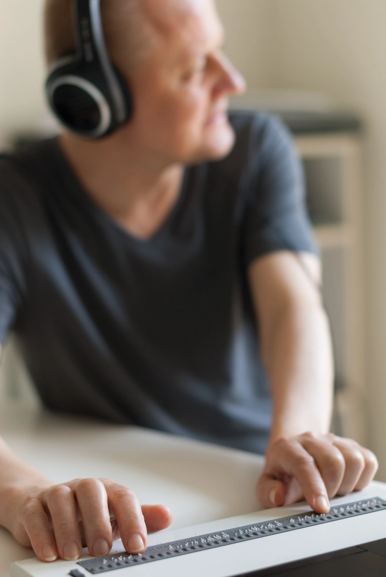 Professional using assistive technology with a laptop